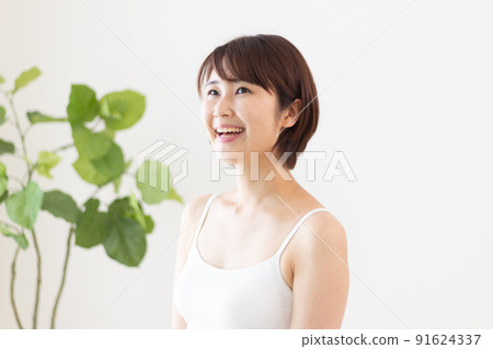 Young woman in a tank top Young woman in a tank top 91624337