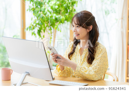 Young woman taking classes remotely Young woman taking classes remotely 91624341