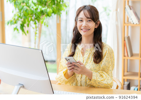 Young woman taking classes remotely Young woman taking classes remotely 91624394