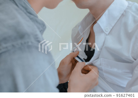 Boy's love photo of a man taking off his shirt 91627401