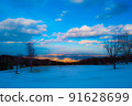Sunset from a snowy mountain 91628699