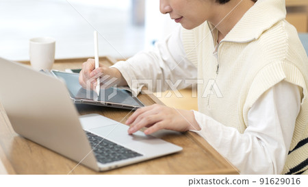 Young female designer body parts to telework 91629016