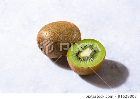 Kiwifruit cut in the background on marble 91629808