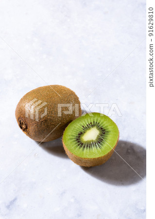 Kiwifruit cut in the background on marble 91629810