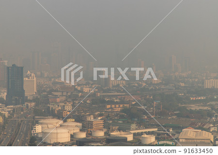 Aerial view of Dust in Bangkok city is full of harmful PM 2.5 dust with bad air pollution, the place to risk of respiratory and cancer. Aerial view of Dust in Bangkok city is full of harmful PM 2.5 dust with bad air pollution, the place to risk of respiratory and cancer. 91633450
