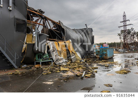 Hostomel, Kyev region Ukraine - 09.04.2022: Outside the store, which was bombed, was looted by Russian soldiers, occupiers. The looters destroyed the shop. Hostomel, Kyev region Ukraine - 09.04.2022: Outside the store, which was bombed, was looted by Russian soldiers, occupiers. The looters destroyed the shop. 91635844
