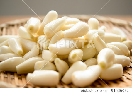 Prepared scallions with roots and tips cut Prepared scallions with roots and tips cut 91636082
