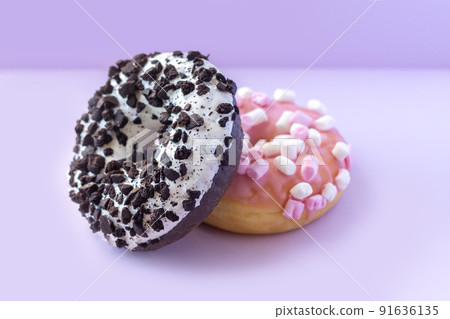 Stack of tasty sweet donuts with sprinkles on table 91636135