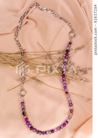 A necklace with the silver and a chain, with beads of lavender amethyst. Handmade jewelry. Vertical photo A necklace with the silver and a chain, with beads of lavender amethyst. Handmade jewelry. Vertical photo 91637284