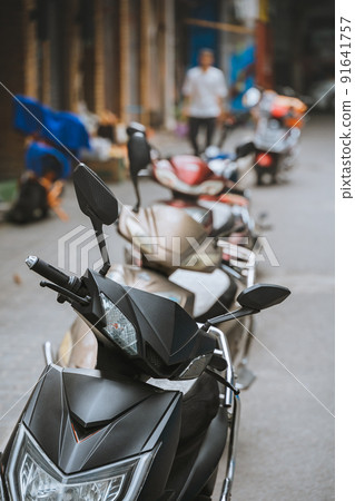 Row of scooters parked in Xian Row of scooters parked in Xian 91641757