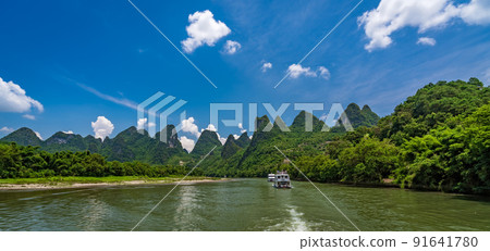 Tourist boat sailing on a Li River in China Tourist boat sailing on a Li River in China 91641780