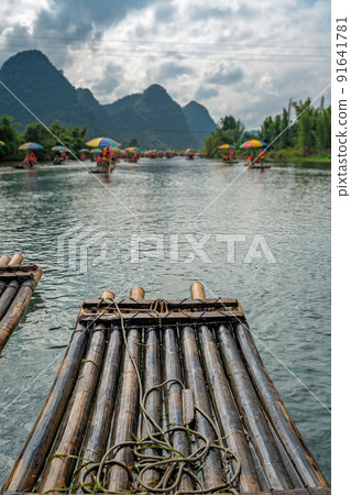 Close up of bamboo raft on a tropical river Close up of bamboo raft on a tropical river 91641781