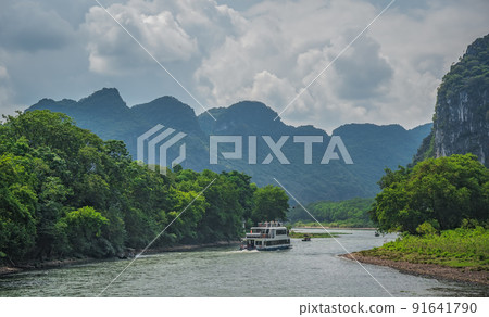 Tourist boat sailing on a Li River in China 91641790