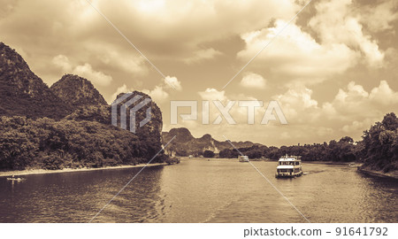 Tourist boat sailing on a Li River in China Tourist boat sailing on a Li River in China 91641792