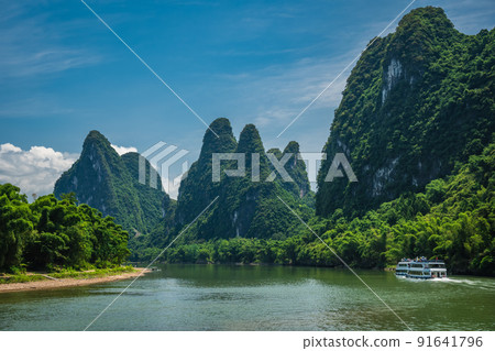 Tourist boat sailing on a Li River in China 91641796