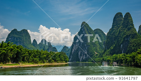 Tourist boats sailing on a Li River in China Tourist boats sailing on a Li River in China 91641797