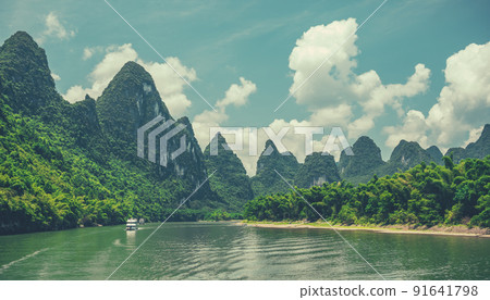 Tourist boat sailing on a Li River in China Tourist boat sailing on a Li River in China 91641798