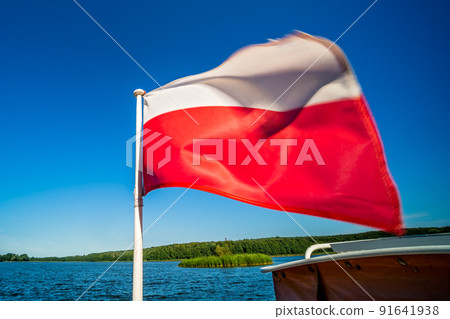 Polish flag on a boat on Jezioro Ostrowieckie in Poland Polish flag on a boat on Jezioro Ostrowieckie in Poland 91641938