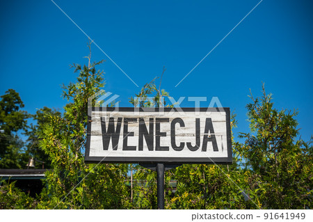 Sign indicating narrow gauge train station in Wenecja, Poland Sign indicating narrow gauge train station in Wenecja, Poland 91641949