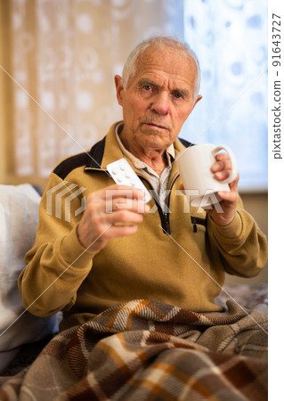 Elderly Senor Treated For Cold With Hot Tea At Home 91643727