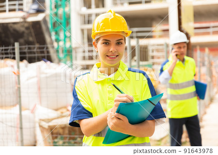 Girl engineer checking work process Girl engineer checking work process 91643978