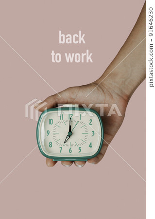 man with an alarm clock and text back to work man with an alarm clock and text back to work 91646230