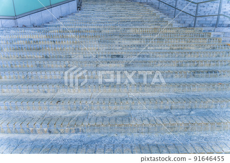 The atmosphere is unstable and heavy rain falls and water flows down the stairs (guerrilla rainstorm) 91646455