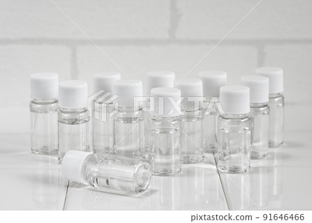 A collection of plastic sample bottles with white lids A collection of plastic sample bottles with white lids 91646466