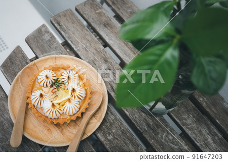 lemon tart on wood table 91647203