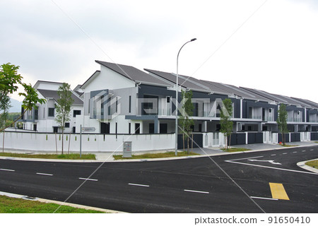 SELANGOR, MALAYSIA -MAY 2, 2022: Selected focused on new double story terrace house under construction in Malaysia. Construction progress is almost complete and almost ready to be occupied. 91650410