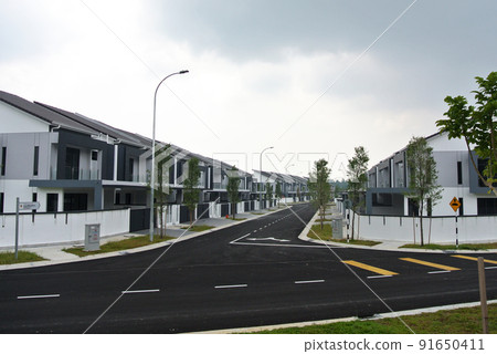 SELANGOR, MALAYSIA -MAY 2, 2022: Selected focused on new double story terrace house under construction in Malaysia. Construction progress is almost complete and almost ready to be occupied. 91650411