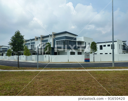 SELANGOR, MALAYSIA -MAY 2, 2022: Selected focused on new double story terrace house under construction in Malaysia. Construction progress is almost complete and almost ready to be occupied. 91650420