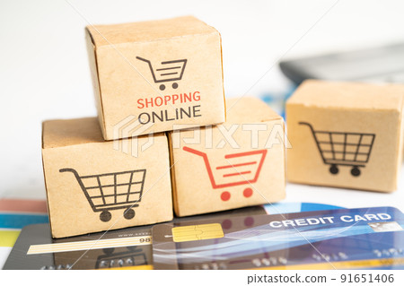 Shopping online box with credit card and calculator on graph. Finance commerce import export business concept. 91651406