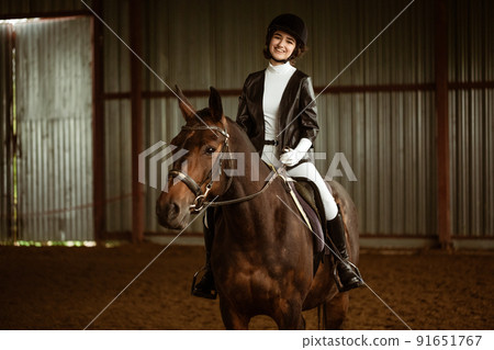 Girl riding a horse. Rider on a horse gallop. Equestrian sport concept. 91651767