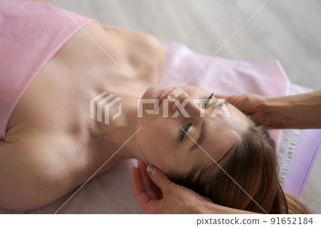 Woman lay on couch on her back with her eyes closed and enjoy. Makes relaxing Woman lay on couch on her back with her eyes closed and enjoy. Makes relaxing 91652184