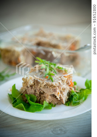 jellied meat with greens and vegetables in a plate jellied meat with greens and vegetables in a plate 91652800