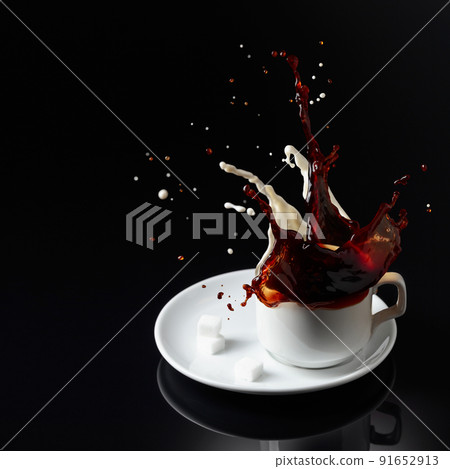Coffee with milk splashing. Coffee with milk splashing. 91652913