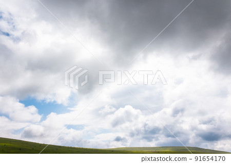 clouds above green hills and meadows. mountain scenery on a sunny day. beautiful summer landscape clouds above green hills and meadows. mountain scenery on a sunny day. beautiful summer landscape 91654170