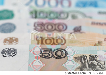 Russian rubles background. Money background and texture. Banknotes of different denominations Russian rubles background. Money background and texture. Banknotes of different denominations 91655361