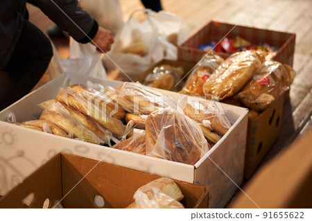 sorting fresh bread in boxes, humanitarian food aid sorting fresh bread in boxes, humanitarian food aid 91655622