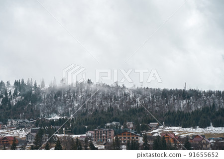 Ukrainian karpaty mountains winter landscape. Village among mountains 91655652