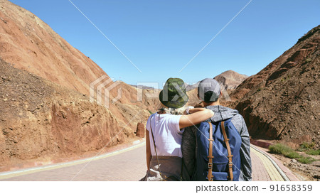 rear view of an asian couple tourists looking at view in national geological park 91658359
