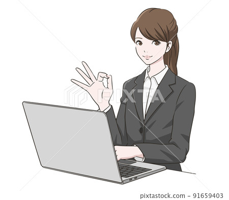 一個穿著西裝的女人在電腦前做一個 OK 標記 91659403
