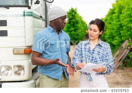 Man and woman are talking about trucking 91659763