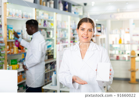 Two pharmacists in drugstore 91660022