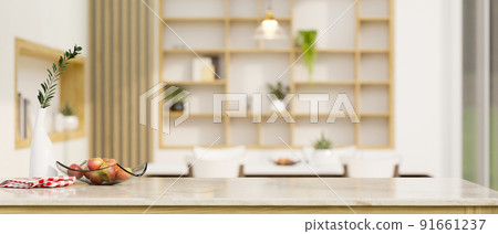 Luxury granite marble kitchen tabletop with copy space over blurred elegance dining room 91661237