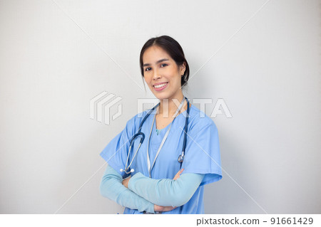 Portrait of young asian nurse in the white room, healthcare workers concept. 91661429