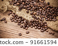 Fresh coffee beans on canvas texture background 91661594