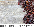 Coffee beans on wood background 91661600