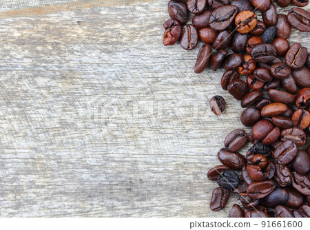Coffee beans on wood background Coffee beans on wood background 91661600